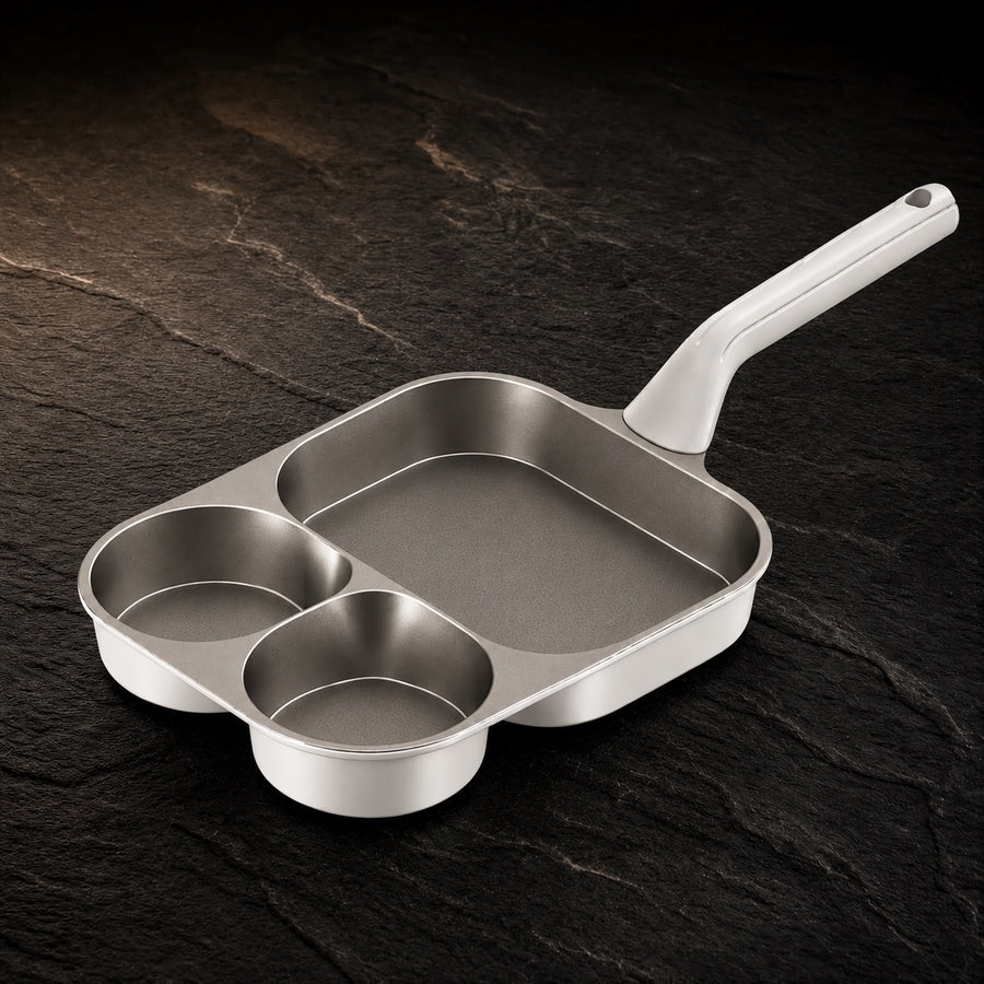 Pure Titanium Breakfast Pan on a dark slate background