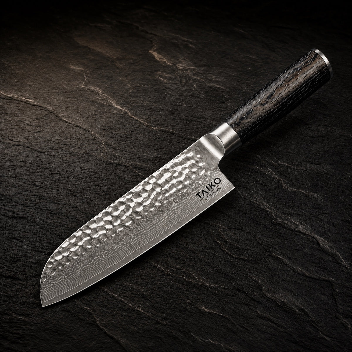 TakumiForge Japanese Hammered Santoku Knife- 7.1 inches (18 cm) on a dark slate background